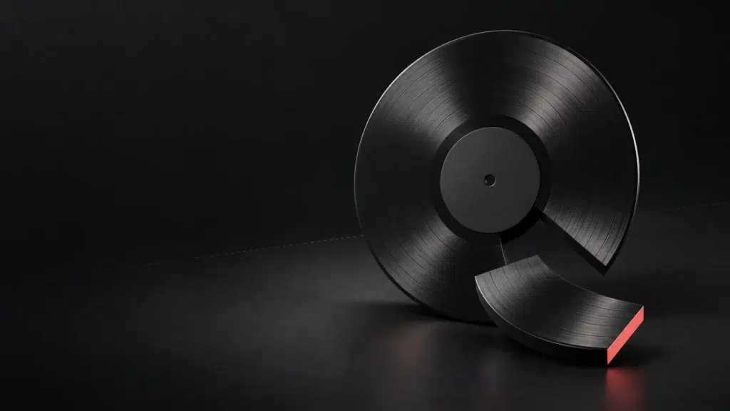 Un disque graphite et un petit segment détaché dont la tranche est corail.